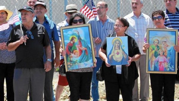 Iraqi Chaldean Catholics rally in support of 27 Chaldeans being held at an ICE detention center in California.