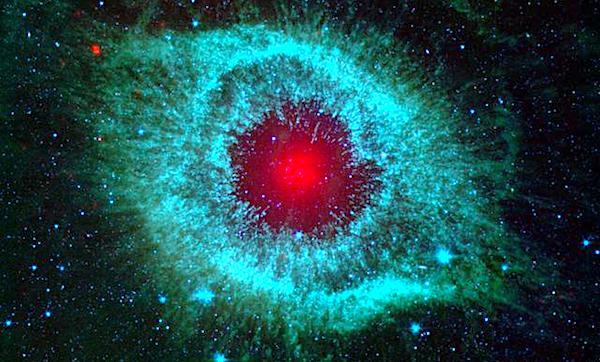 This infrared image from NASA Spitzer Space Telescope shows the Helix nebula, a cosmic starlet often photographed by amateur astronomers for its vivid colors and eerie resemblance to a giant eye. (NASA/JPL-Caltech/University of Arizona)
