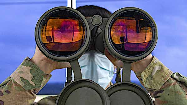Air Force Staff Sgt. Daniel Cabezas scans the horizon for landing lights and obstructions on the flightline at Aviano Air Base, Italy, May 7, 2021. (U.S. Air Force photo by Airman 1st Class Brooke Moeder)
