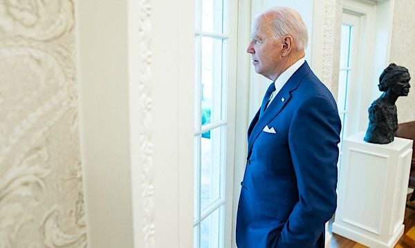 President Joe Biden looks out the window of the Oval Office to the Rose Garden of the White House Monday, July 26, 2021, prior to the president's remarks on the 31st Anniversary of the Americans with Disabilities Act. (Official White House photo by Adam Schultz)