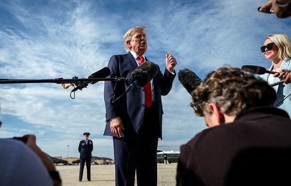 President Donald J. Trump speaks with members of the media alongside outgoing White House Press Secretary Karoline Leavitt, before boarding Air Force One at Joint Base Andrews, Maryland, Friday, Aug. 21, 2026, en route to South Carolina. (Official White House photo by Molly Riley)